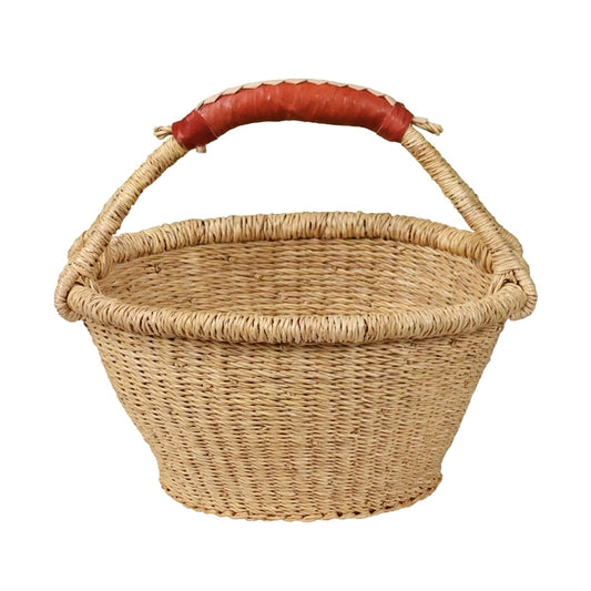 Flat bottomed fruit basket with a round tapered bowl design and a tan leather handle.