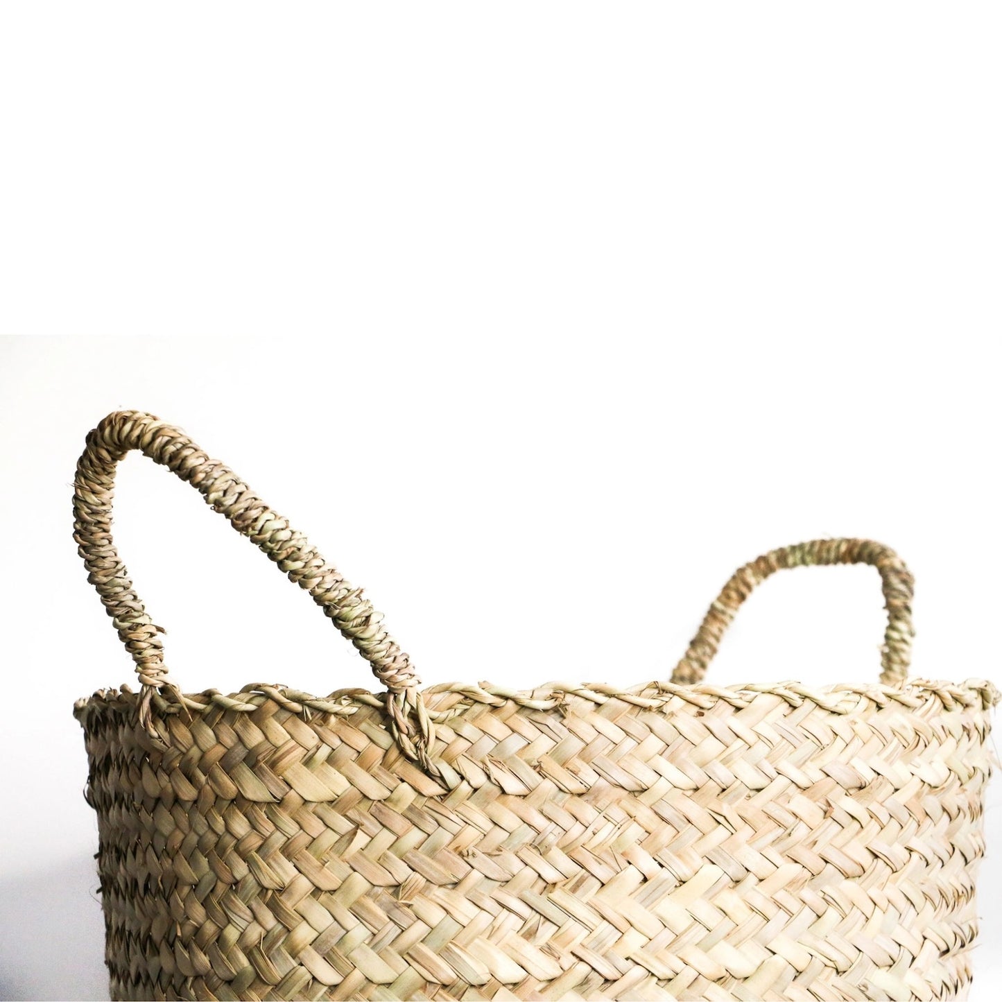 Close up picture of woven hamper with handles.