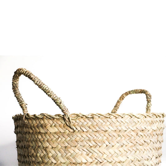 Close up picture of woven hamper with handles.