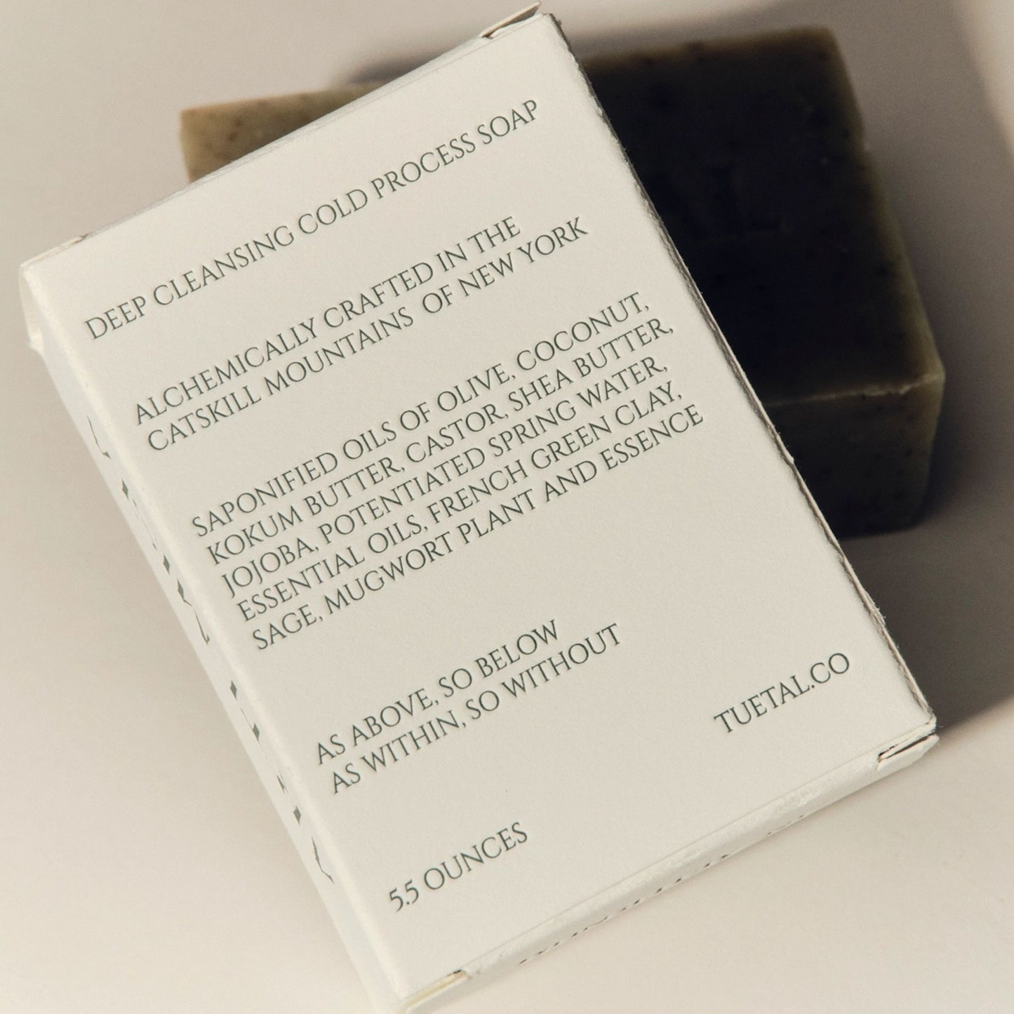 TU.ET.AL soap bar with packaging on a neutral background