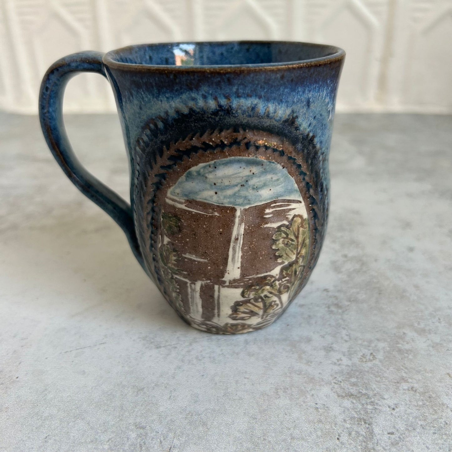 Waterfall & Bird Ceramic Mug by Danielle Payette