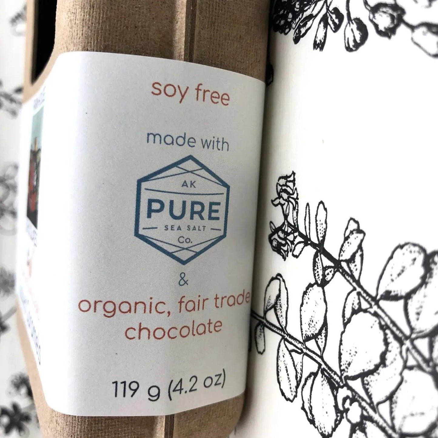 Shows the package of the Dark Chocolate Salted Caramels which says that it is soy free, organic, fair trade chocolate