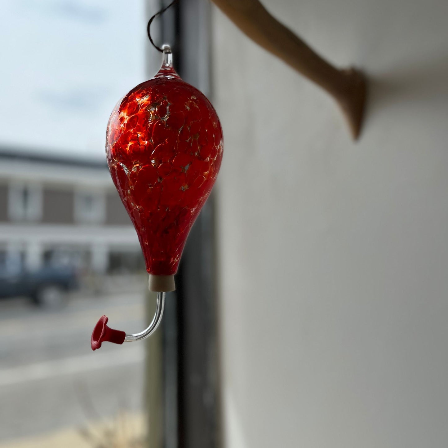 Red unique Glass Hummingbird Feeder.They are handblown glass made in the USA. The feeder tube is removable allowing for easy cleaning and refilling.