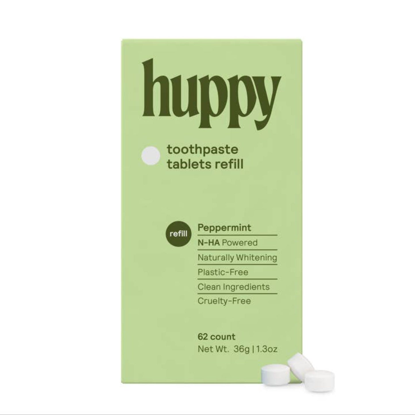 A green box with the "Huppy" logo and information about the tablets. Alongside the box is three tablets.