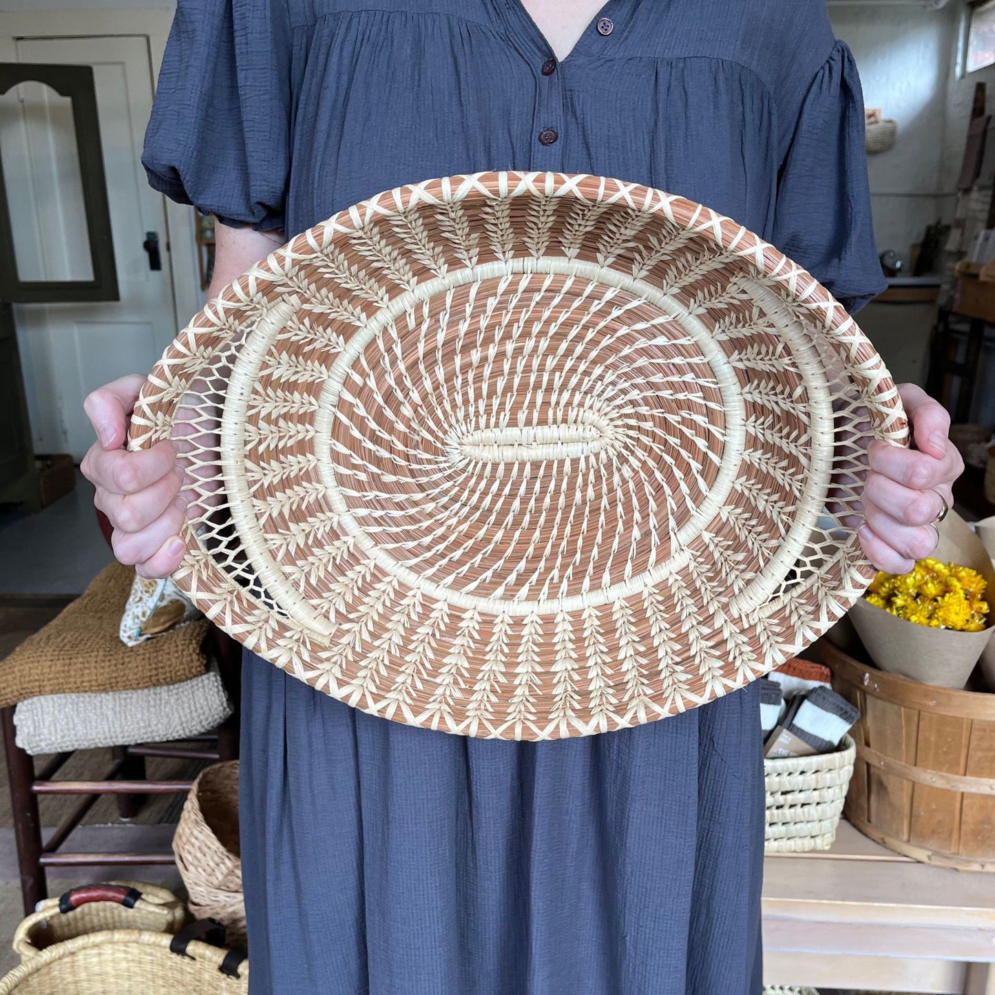 Pine Needle Basket hold by a woman