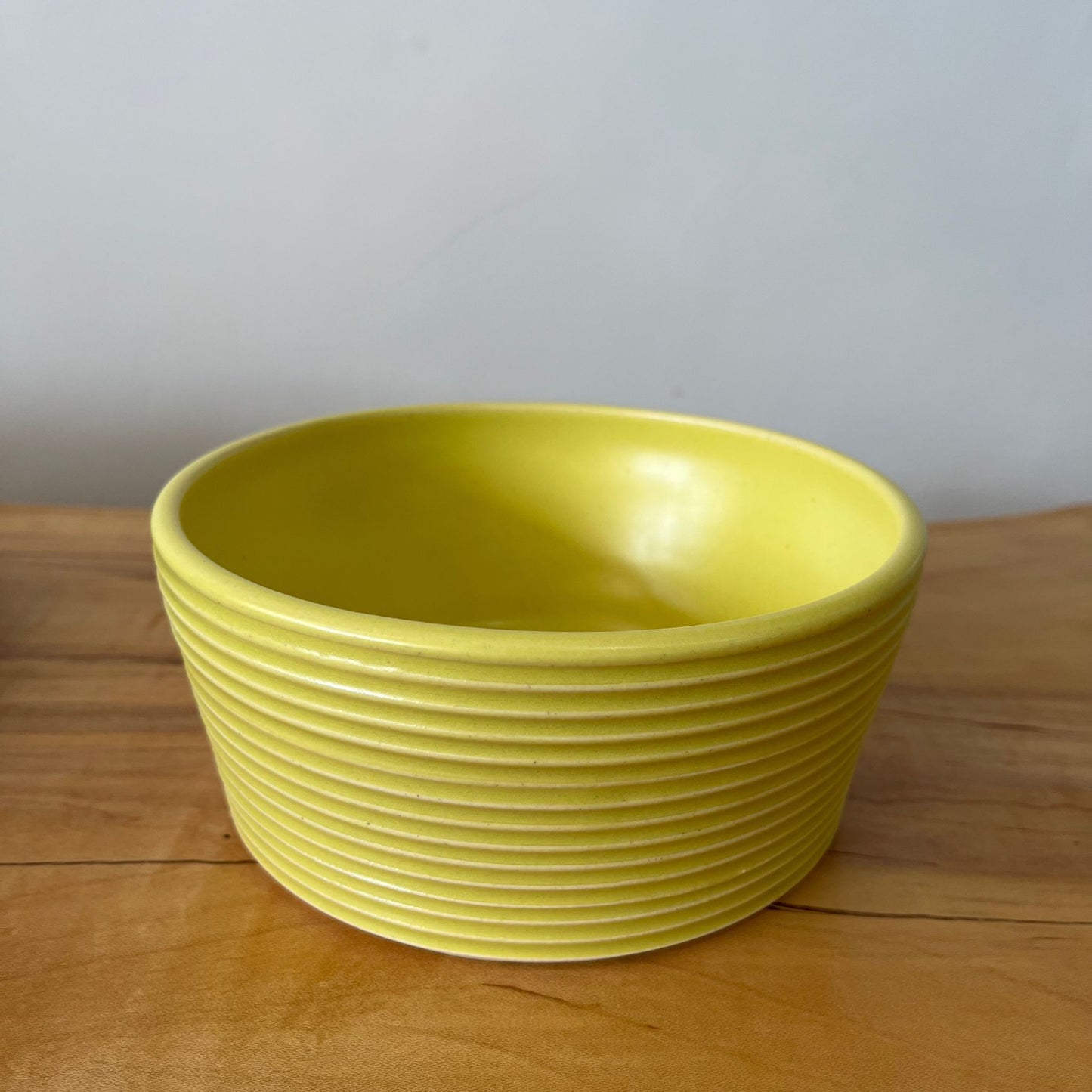 Wheel-thrown ribbed ceramic stoneware dinner bowl with handmade glaze in yellow/ zest color. 6" x 2.5"