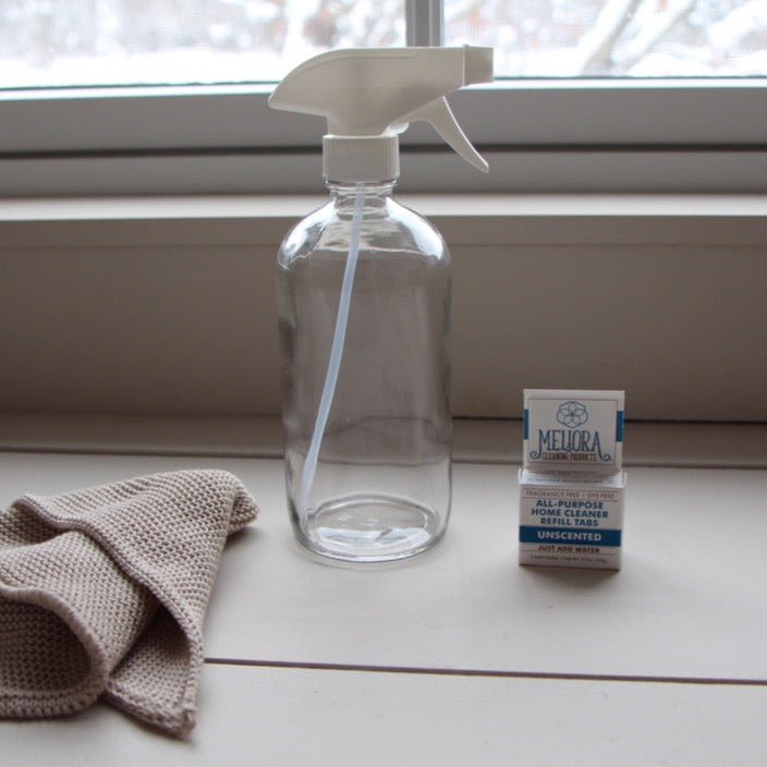 box 3 of water-dissolvable all-purpose home cleaning tablets shown with reusable glass spray bottle