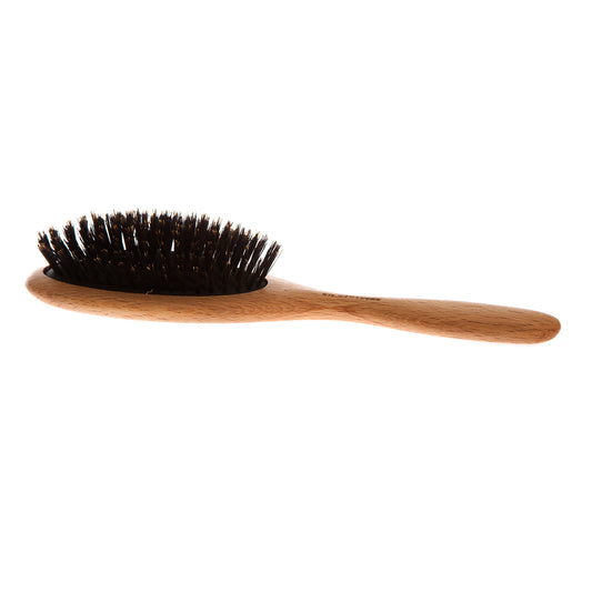 A beech wood hairbrush with wild boar bristles and a cushion in natural rubber