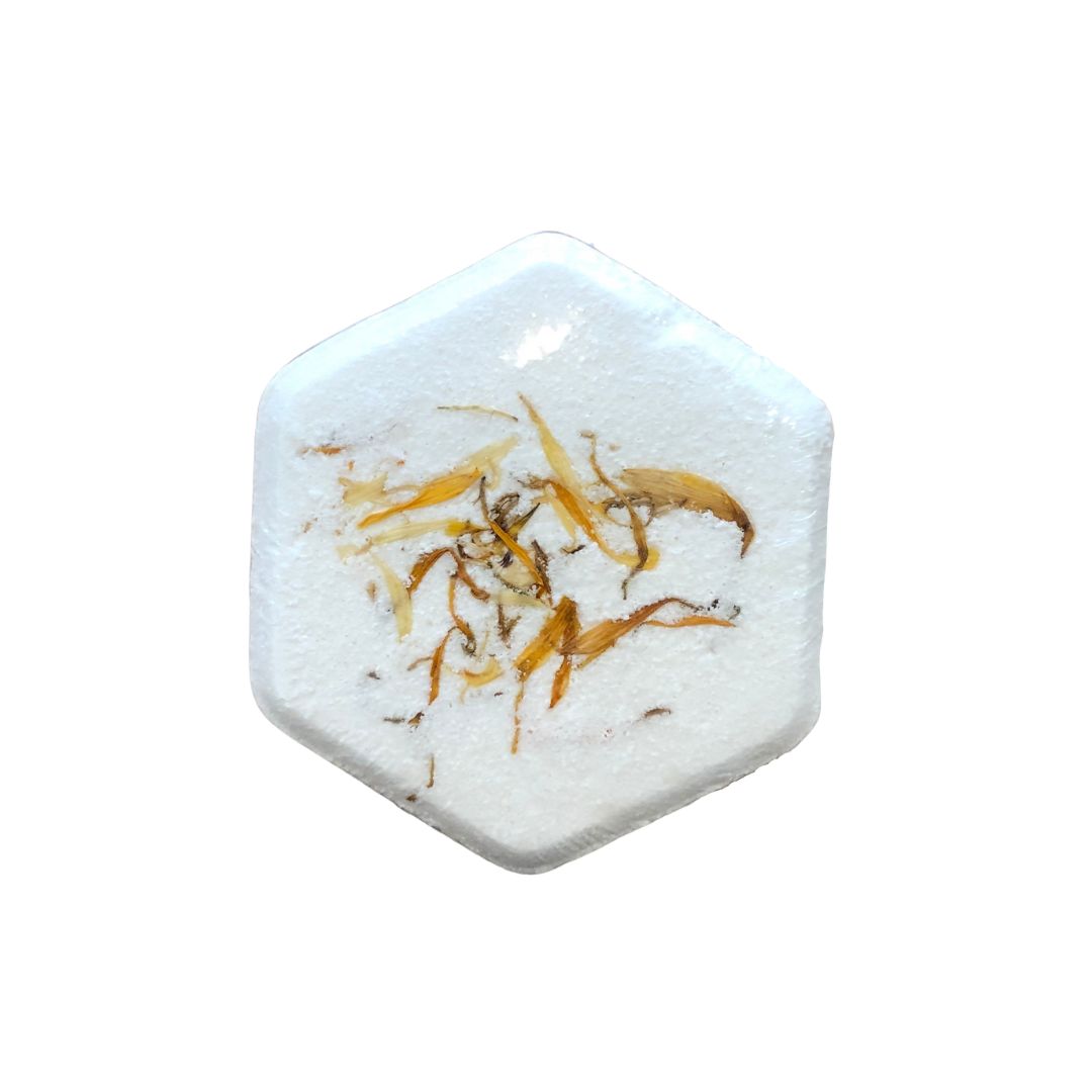 Bath bomb made of milk, honey, butters and pure essential oils of lemon, grapefruit and patchouli