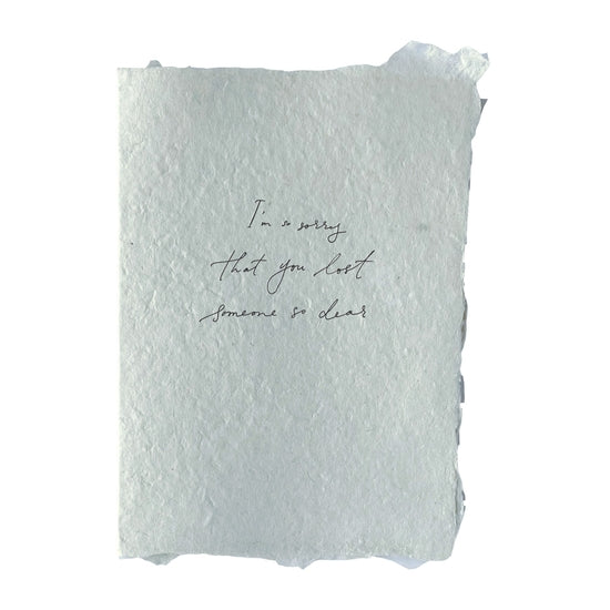 Handmade paper card with black letterpress ink, message on front reads: “I’m so sorry that you lost someone so dear"