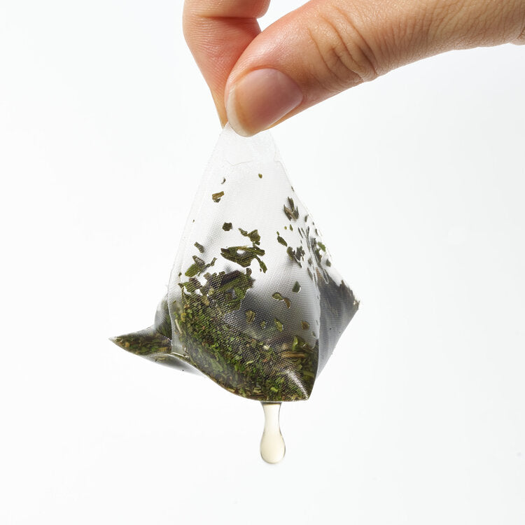 Organic mint tea sachet in use