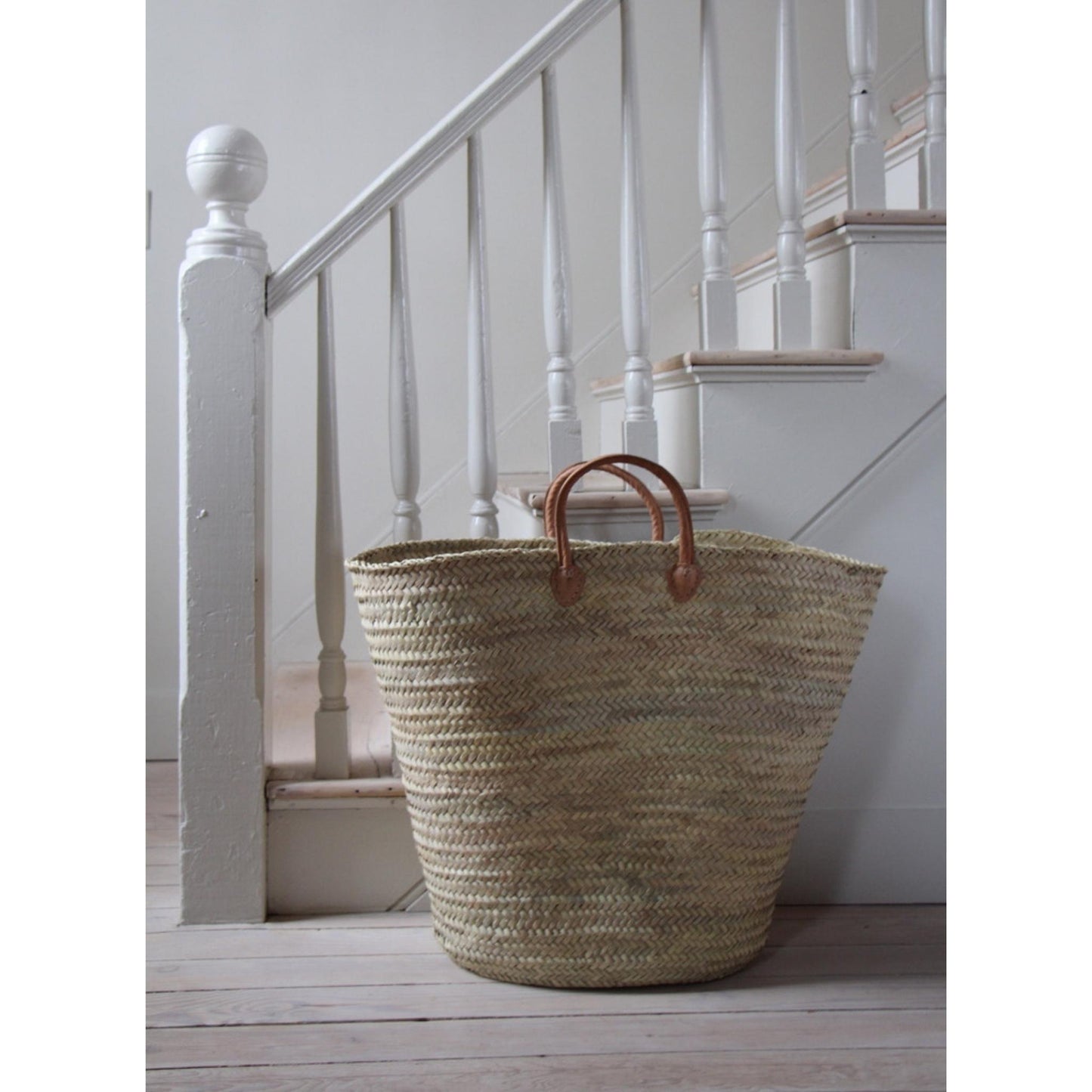 basket at bottom of stairs