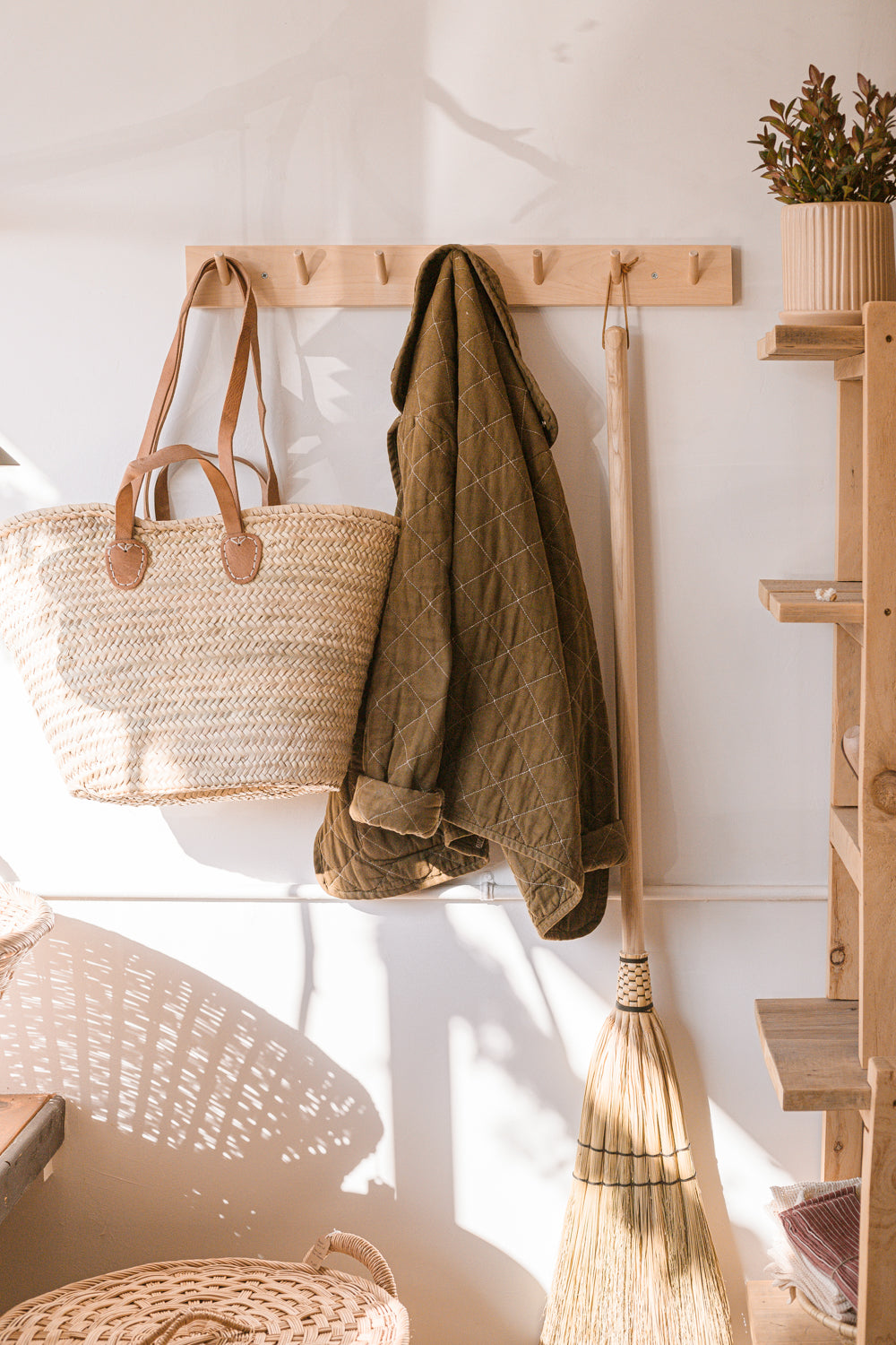 Example of Simple rail hanging rack with 7 peg hooks made of Birch wood