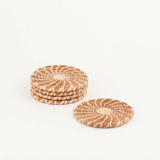 Set of four 4" tan and brown pine needle coasters.