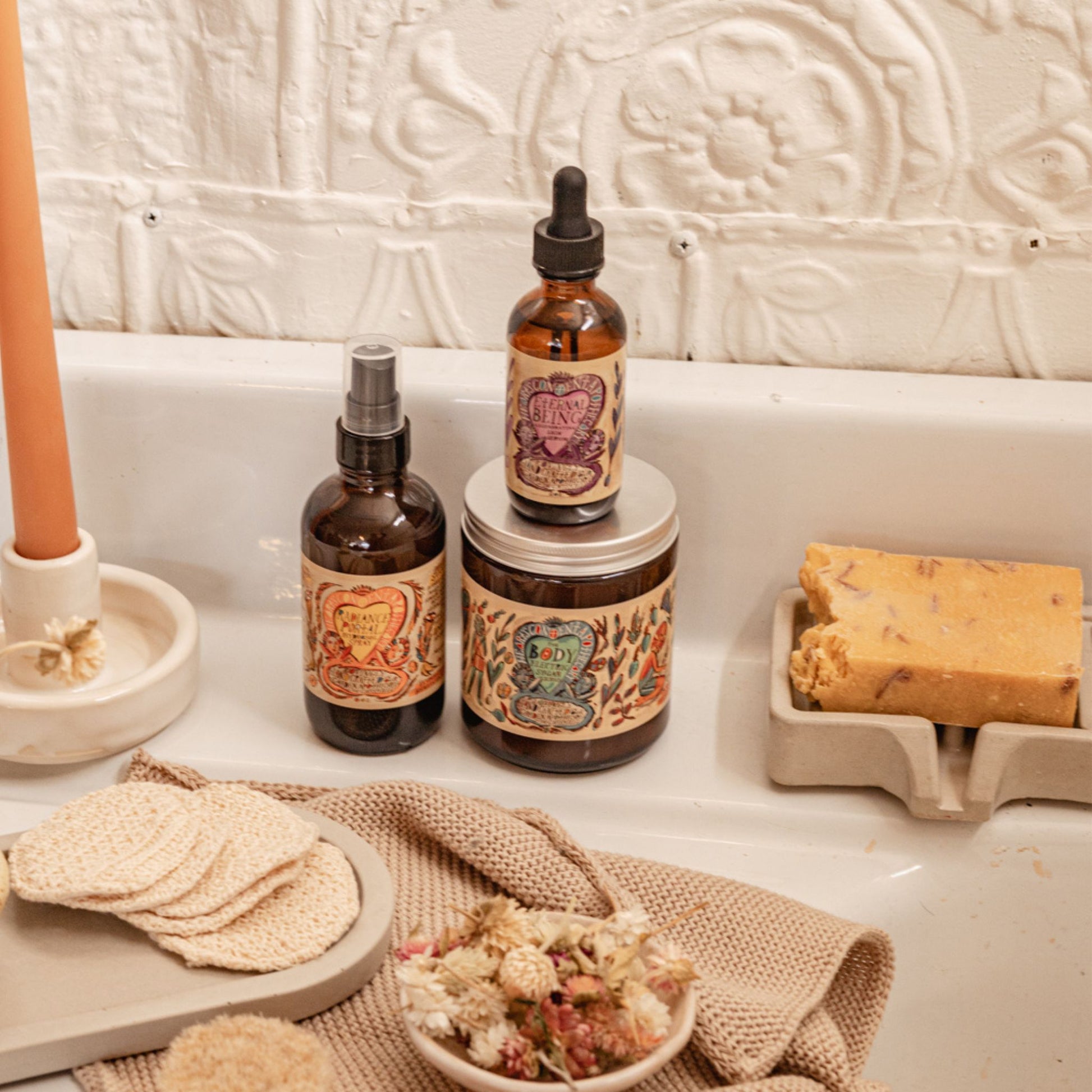 Concrete Soap Dish with Drain in grey color on a sink with other bath accessories