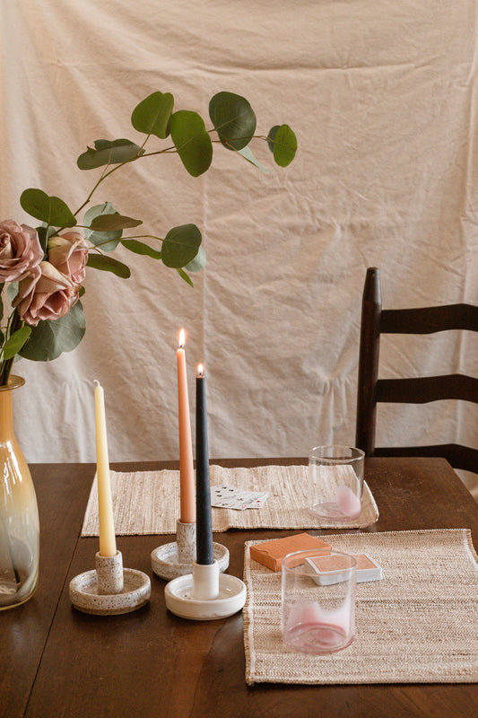 10-inch tall smooth taper candles shown in candlesticks on dining table