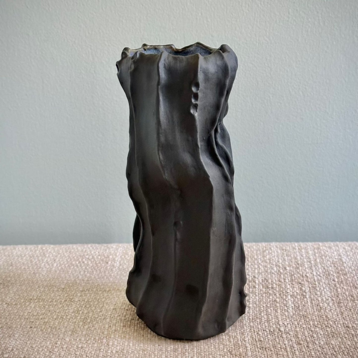 Black ribbed vase by Anne Gabriele