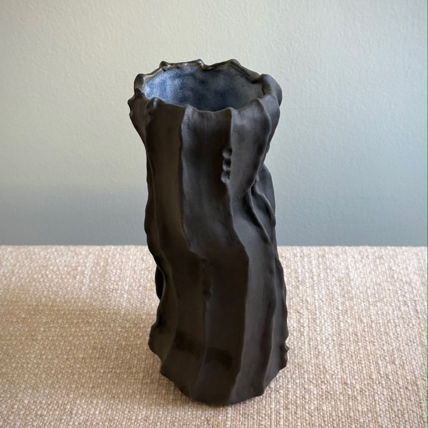 Black ribbed vase by Anne Gabriele