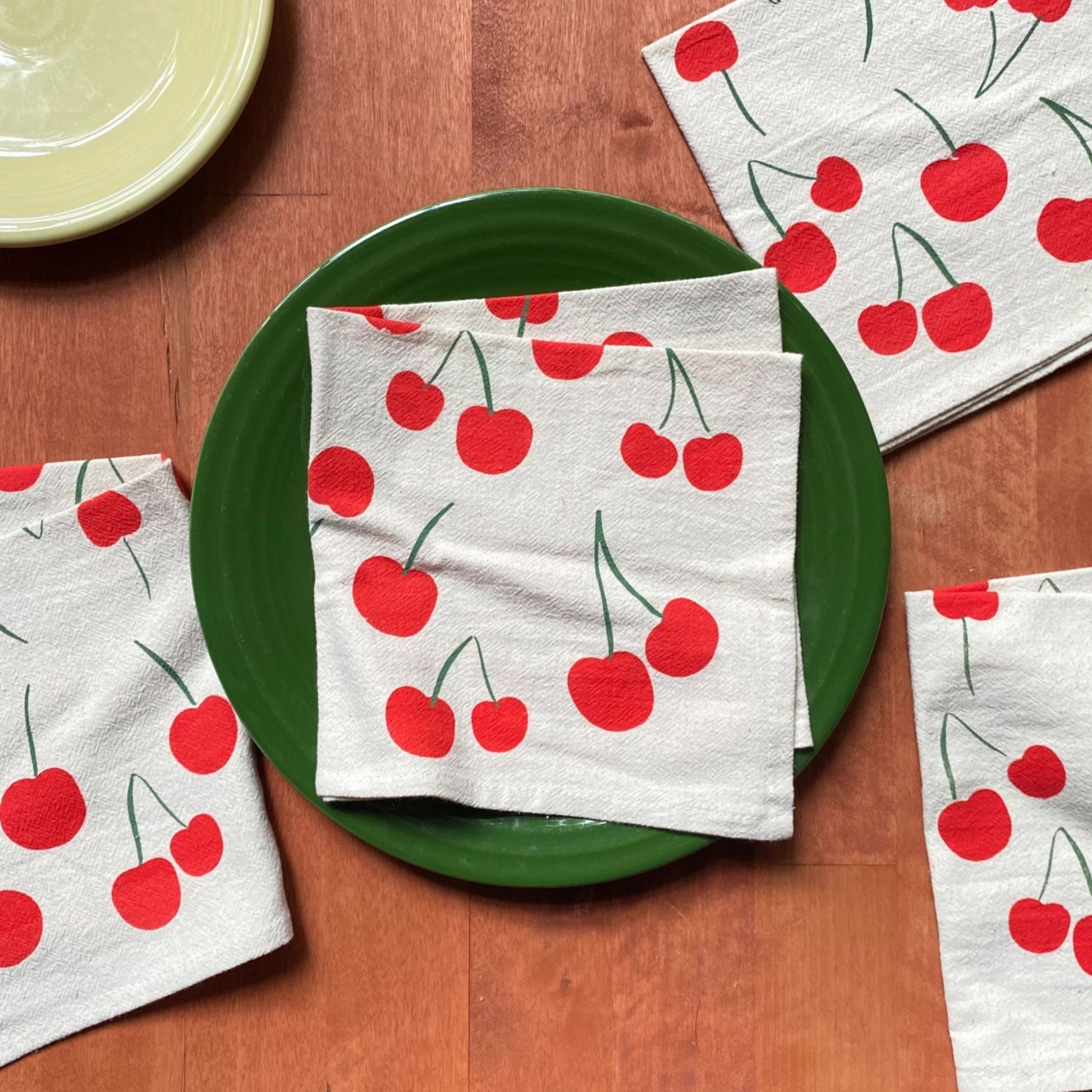 Napkins with cherry pattern on a wooden table