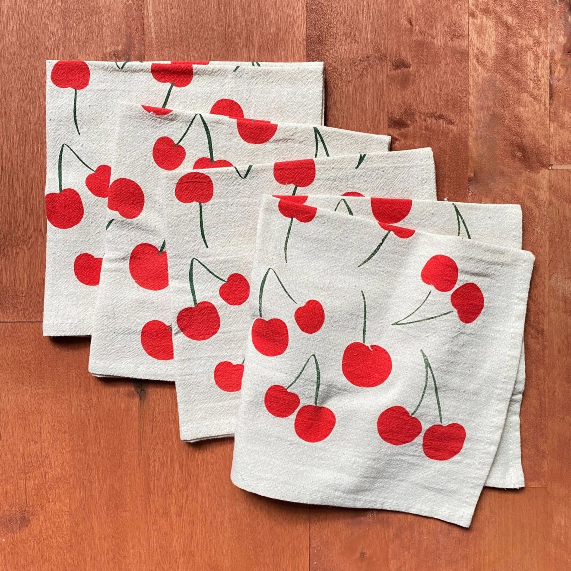 Napkins with cherry pattern on a wooden table