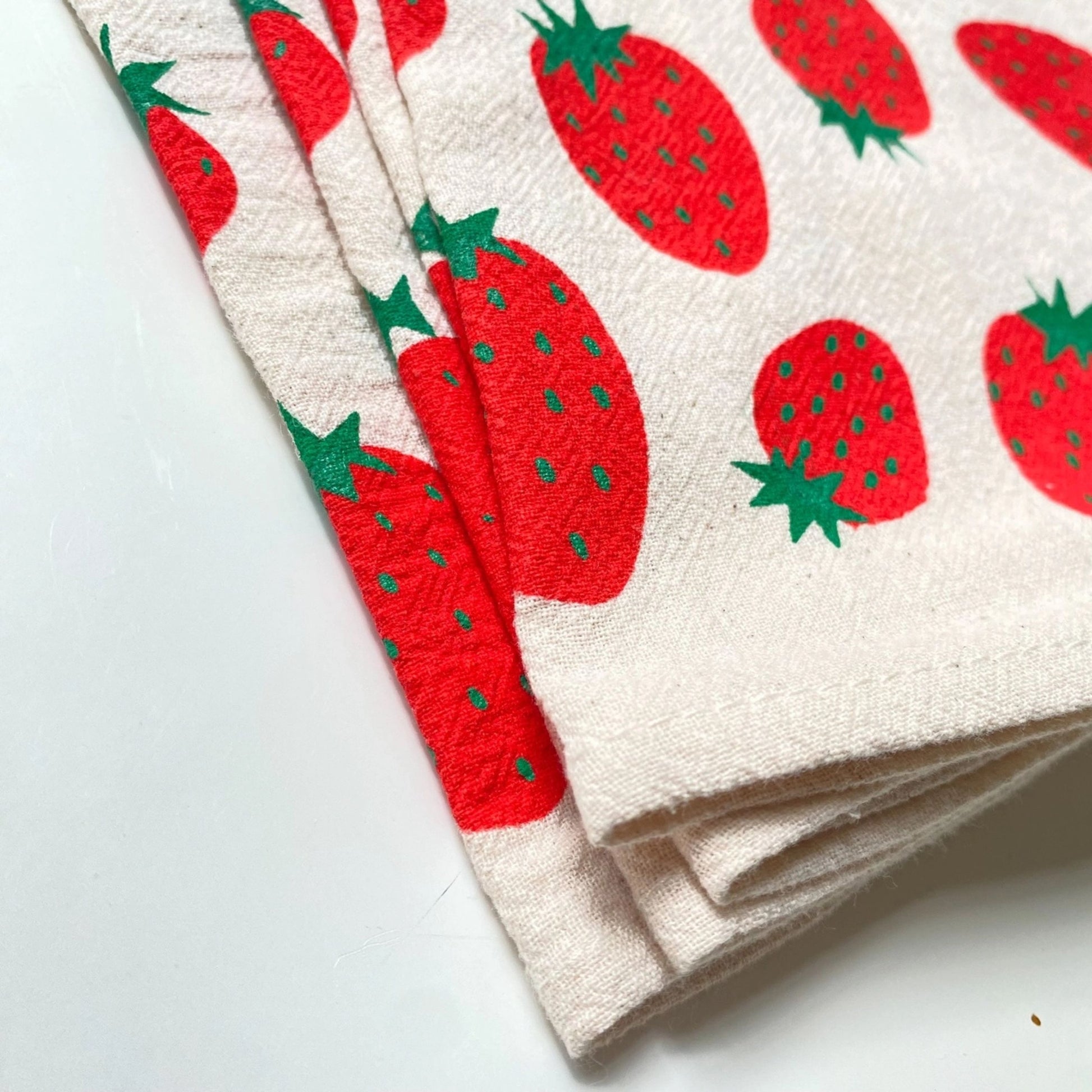 Set of kitchen towels with strawberry pattern on a white background