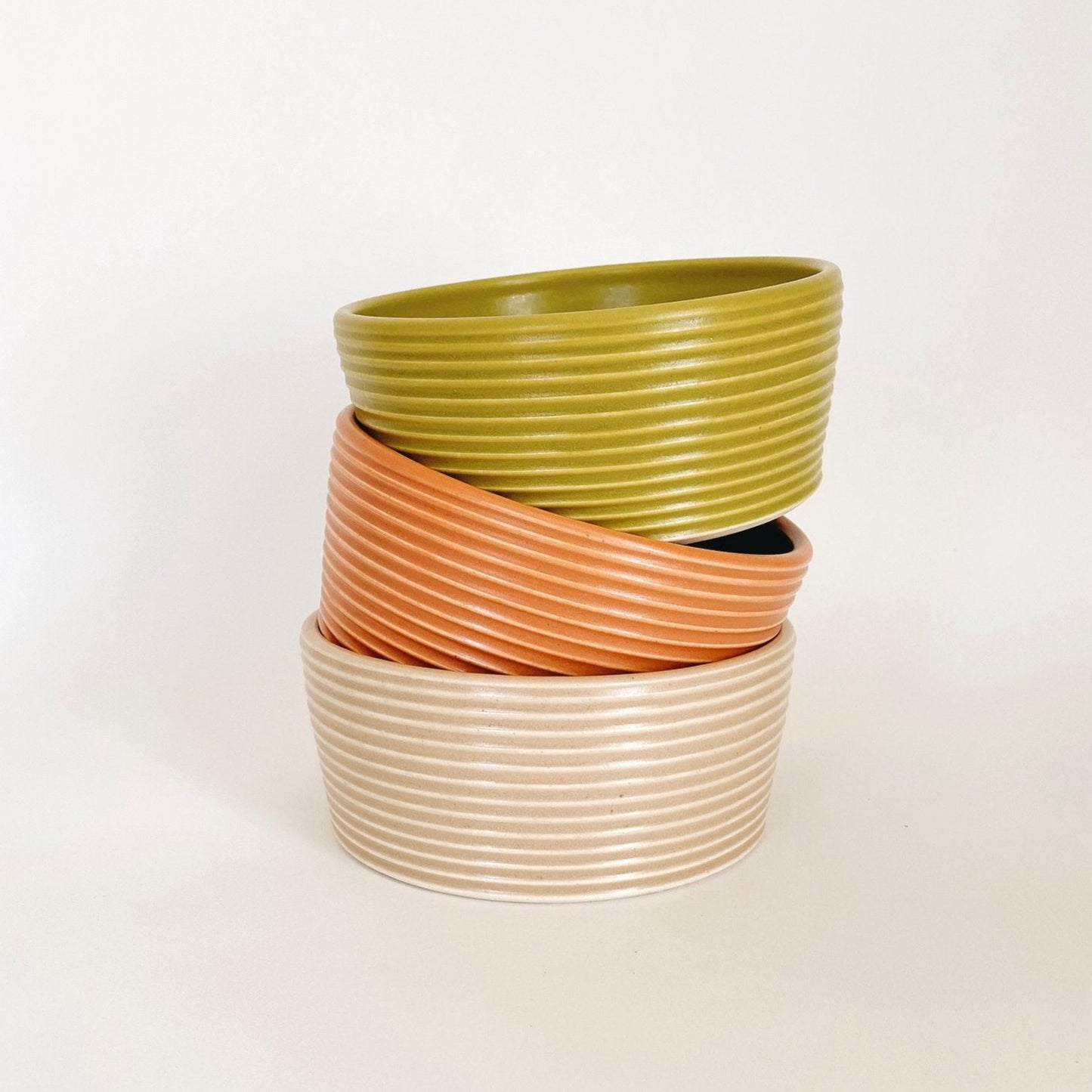 3 pieces of Wheel-thrown ribbed ceramic stoneware dinner bowl with handmade glaze in orange, yellow and white color. 6" x 2.5"