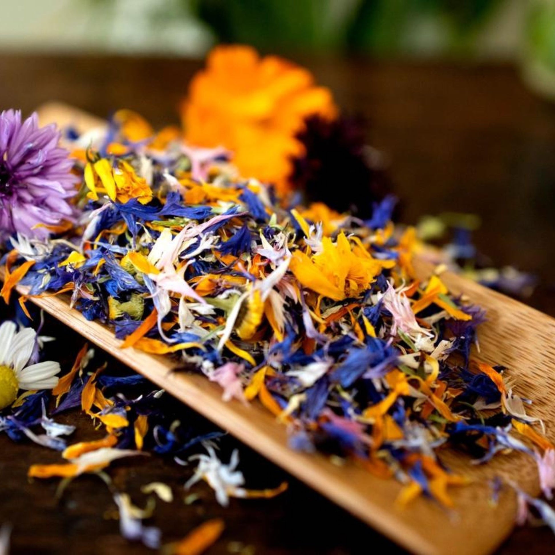 Edible dried flowers on a wooden plate