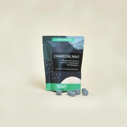 Charcoal Mint Toothpaste Refill Pouch counts 62 tabs. These tablets are made with clean ingredients like peppermint oil, coconut oil, aloe vera extract, and xylitol, and contain nano-hydroxyapatite, a non-toxic fluoride alternative that remineralizes tooth enamel & helps fight sensitivity.