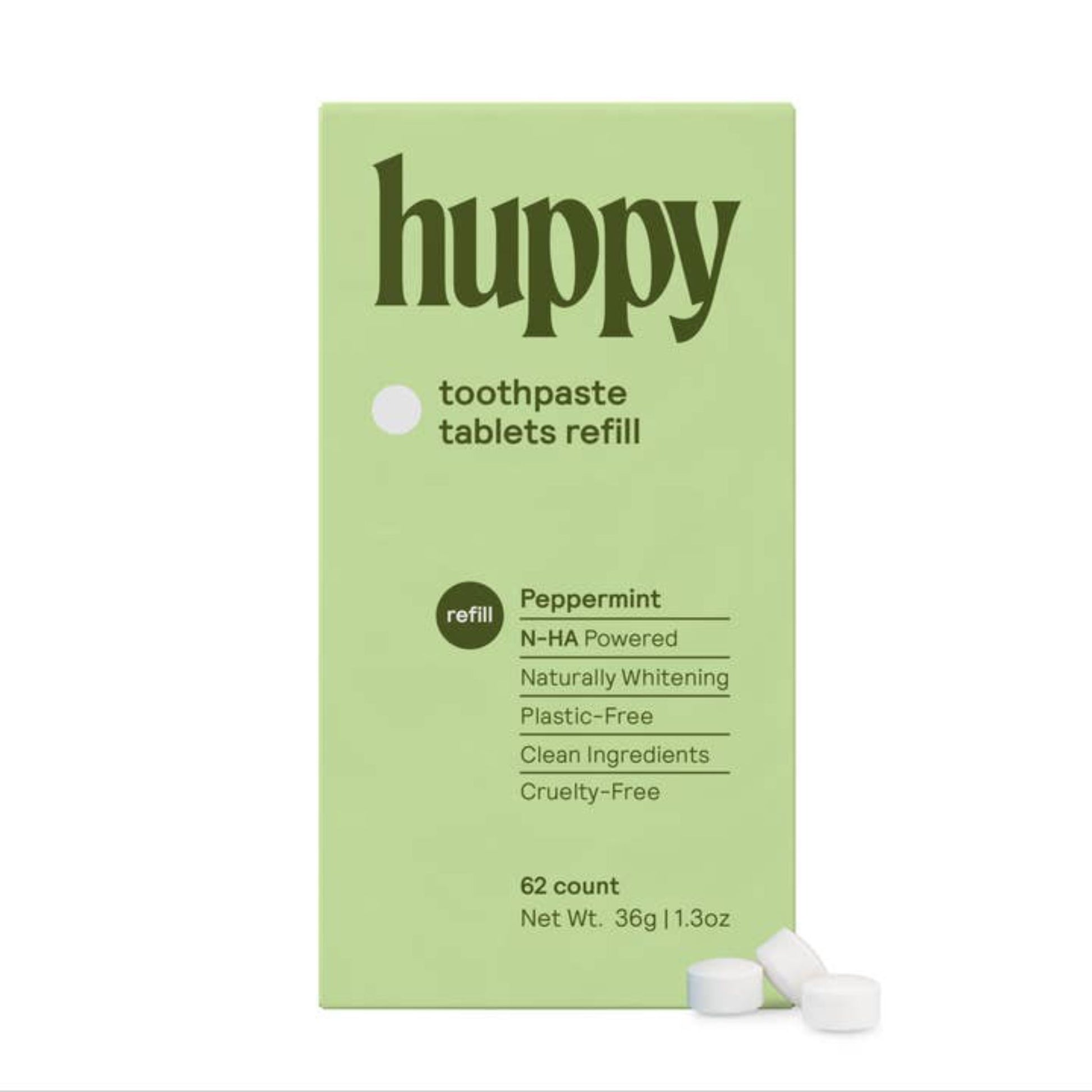 A green box with the "Huppy" logo and information about the tablets. Alongside the box is three tablets.