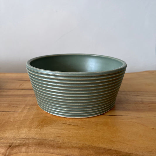 Wheel-thrown ribbed ceramic stoneware dinner bowl with handmade glaze in jade color. 6" x 2.5"