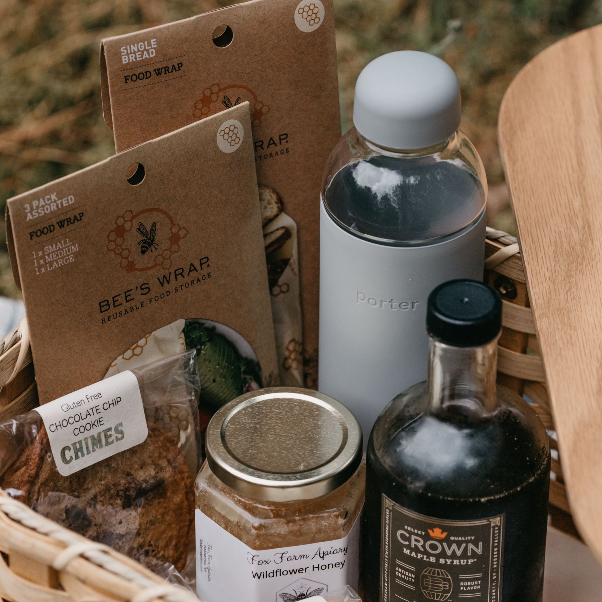 Goody Basket with Bourbon Barrel Aged Organic Maple Syrup, Bread Bees Wrap, Chocolate Chip Cookies, Wildflower Honey and a Glass Water Bottle