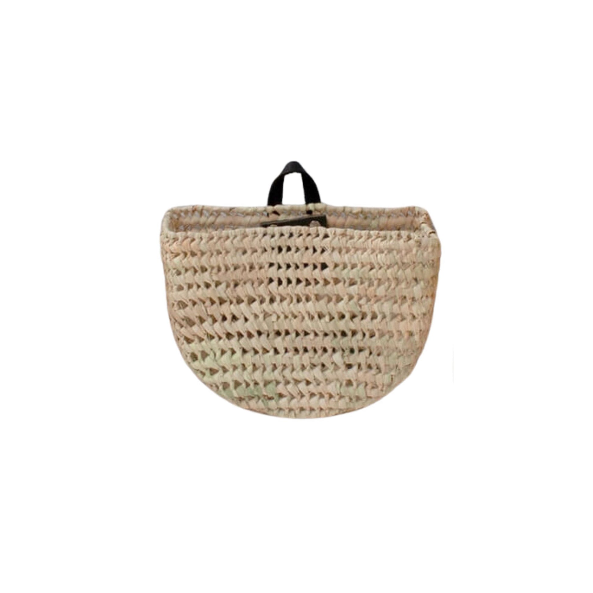 A round hanging basket with a black leather handle.