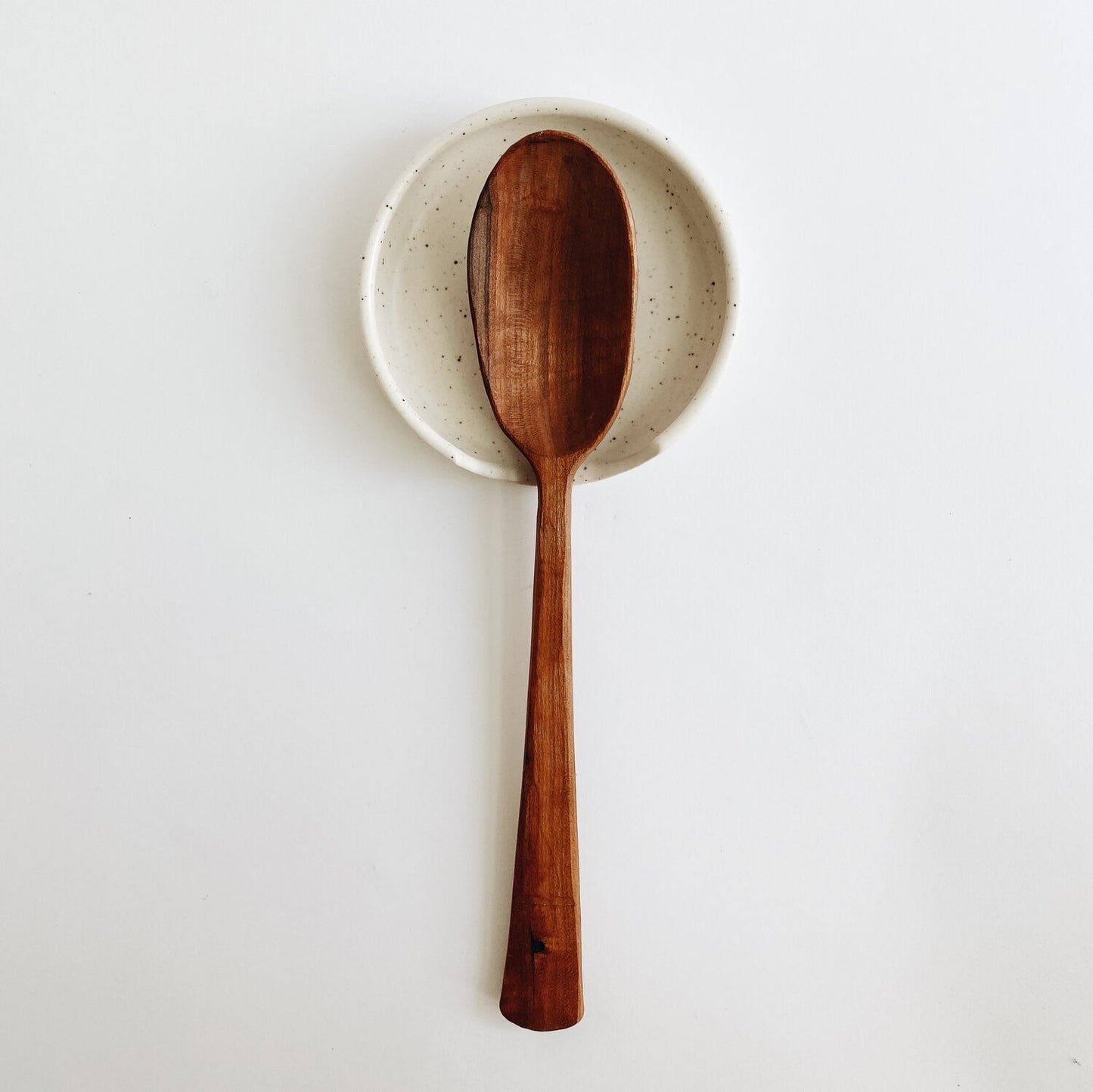 Spoon rest in white speckled glaze with wooden spoon