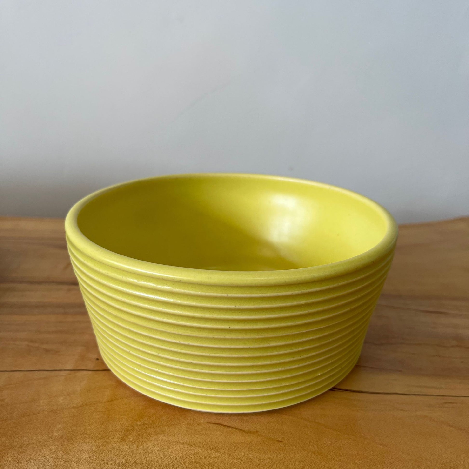 Wheel-thrown ribbed ceramic stoneware dinner bowl with handmade glaze in yellow/ zest color. 6" x 2.5"