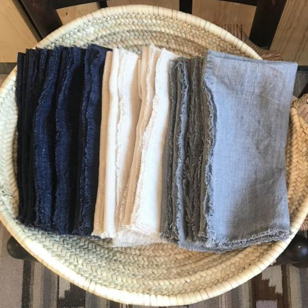 20-inch square stonewashed linen napkins with fringe edge shown in three colors