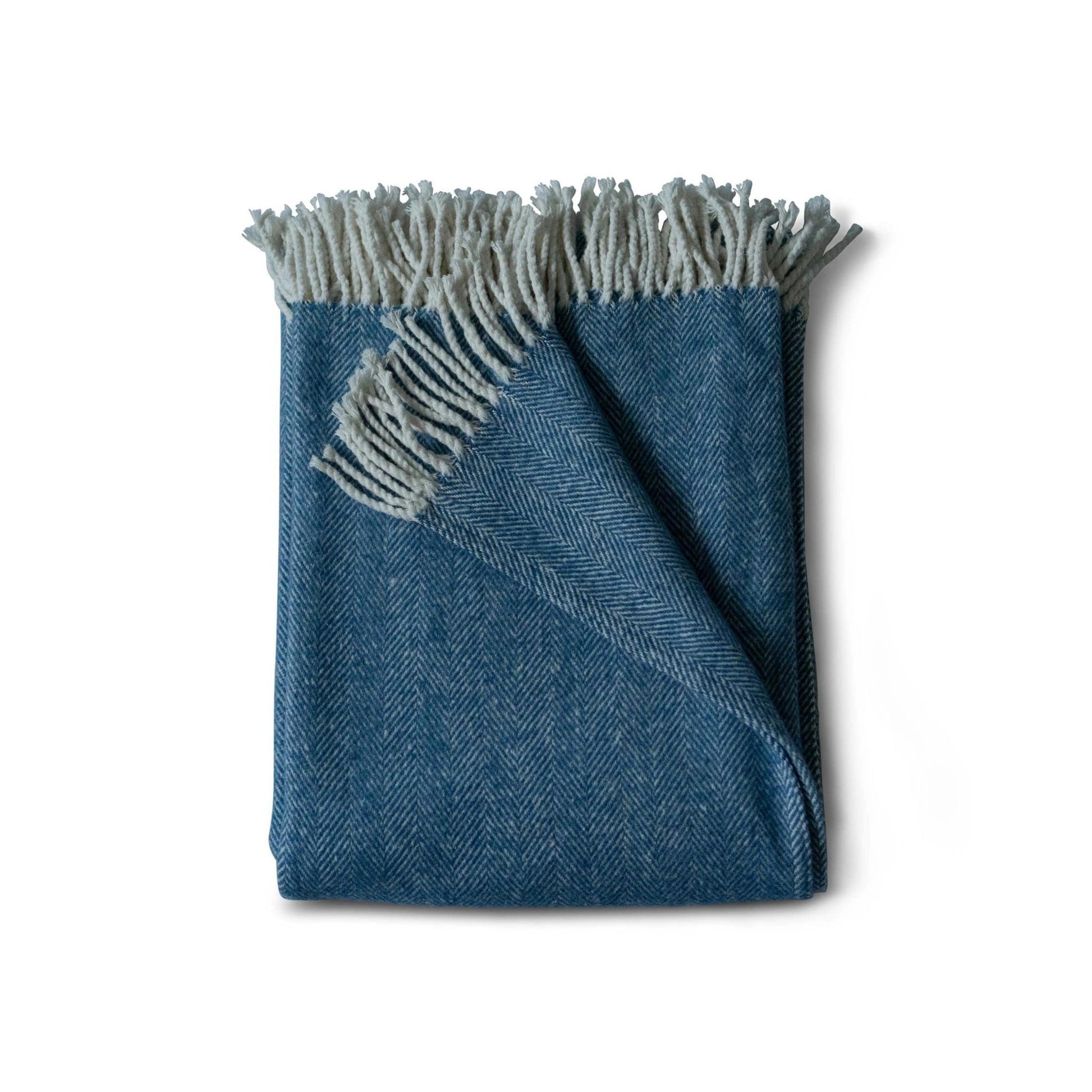 Brushed cotton throw blanket in steel blue herringbone pattern with cotton fringe  