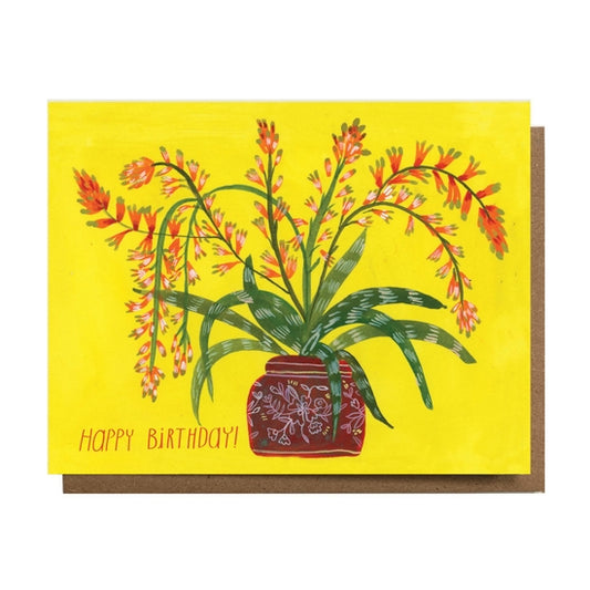 Folding card with illustration of flowering cactus in painted pot Happy Birthday! written on left