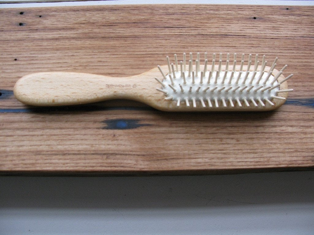 wooden hair brush with wooded pins and natural rubber 