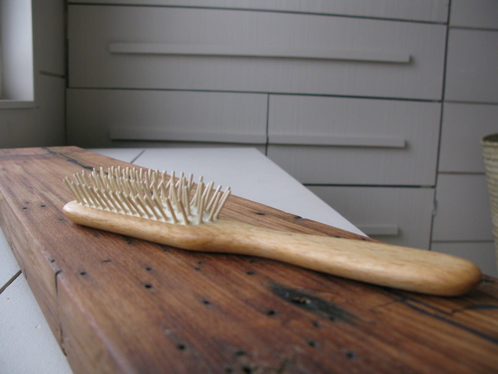 hair brush with wooden pins and natural rubber
