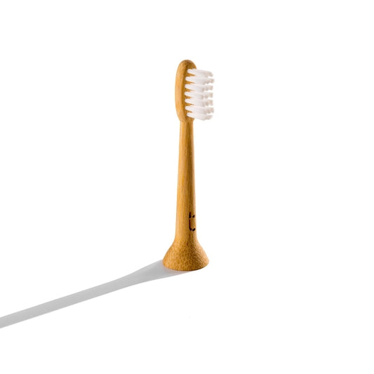 Solid bamboo electric toothbrush head with castor oil bristles
