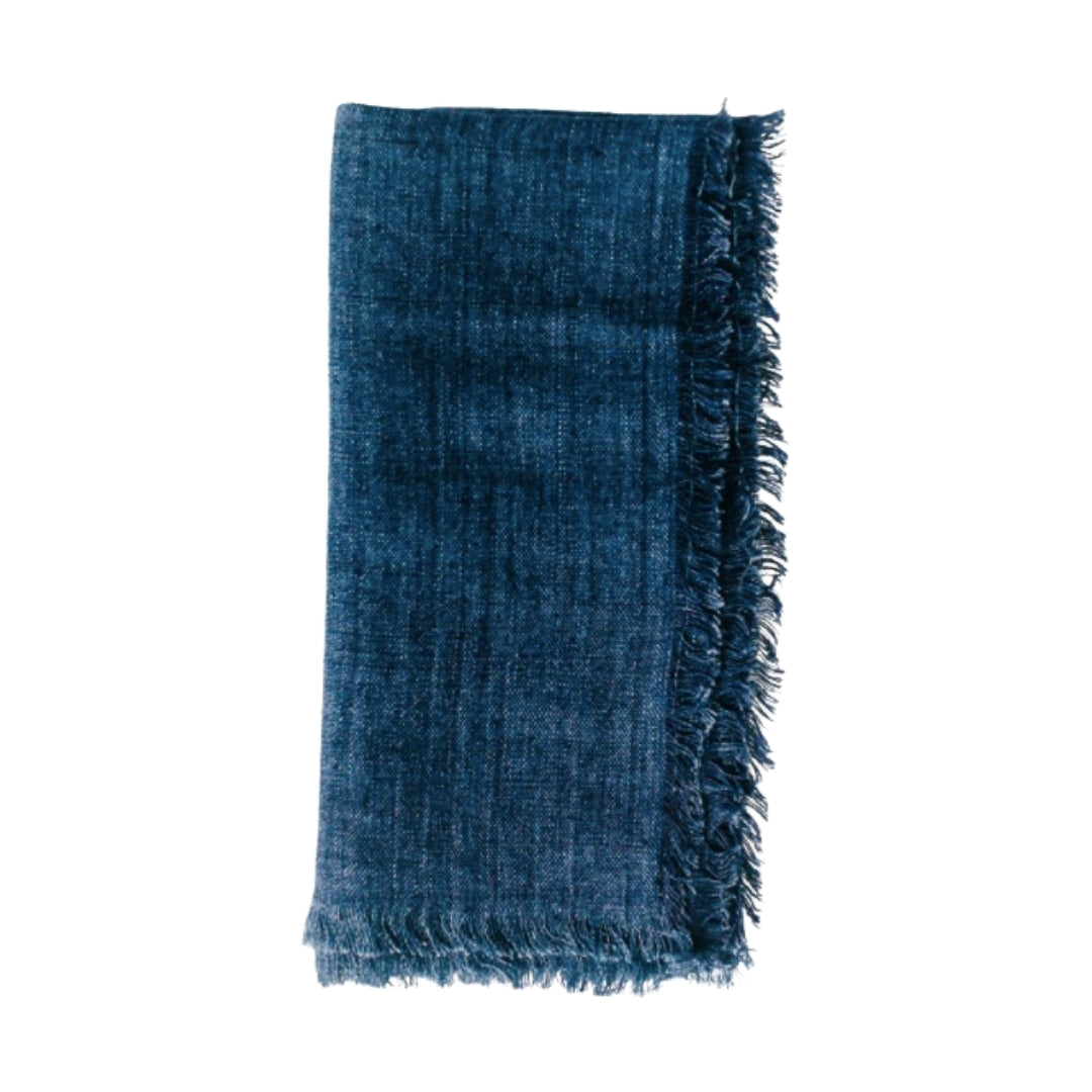 20-inch square stonewashed linen napkins with fringe edge shown in indigo blue