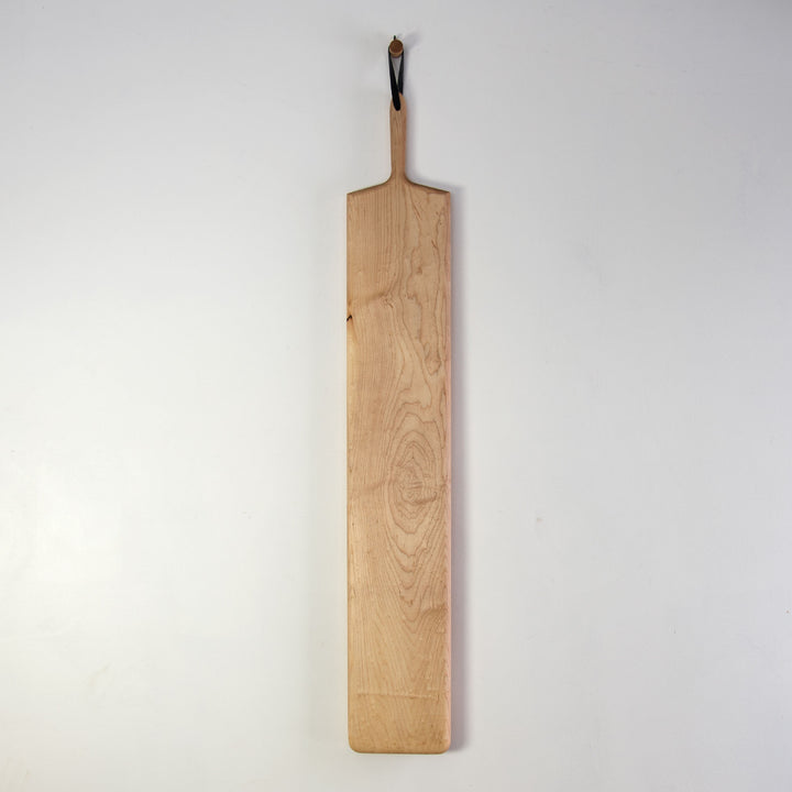 48 inch long rectangular cutting or serving board  in maple wood with handle and leather strap