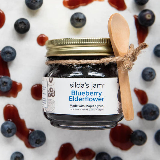 Jar of all-natural vegan Blueberry Elderflower jam sweetened with maple syrup