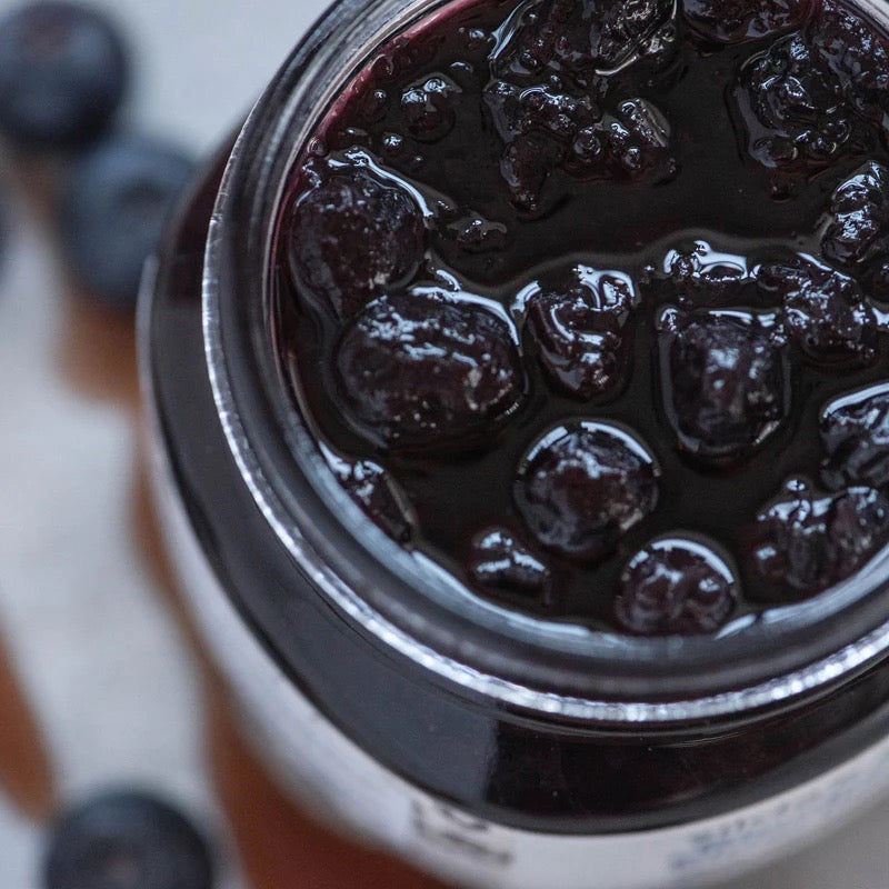 Jar of all-natural vegan Blueberry Elderflower jam sweetened with maple syrup