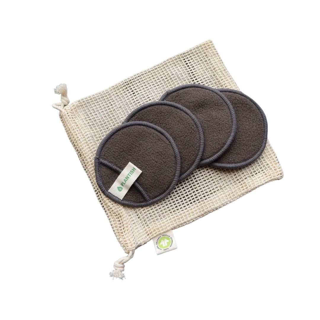 4 reusable bamboo face rounds displayed on mesh drawstring bag
