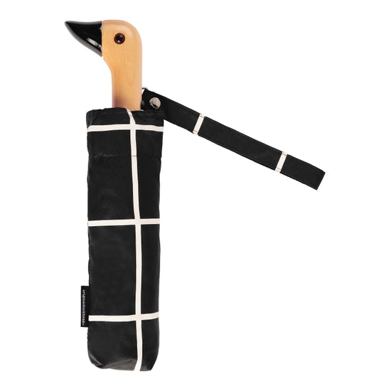 Compact umbrella with black and white grid pattern and birchwood handle in the shape of duck head
