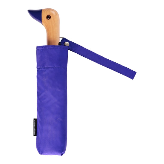 Compact umbrella in vivid blue with birchwood handle in the shape of duck head