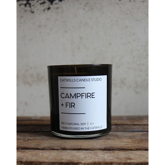 Campfire + Fir Candle which is Hand-poured in the Catskill Mountains made from 100% natural soy and essential oils and fragrance. Notes are: Saffron, Cypress, Saffron, Cypress, Clove, Evergreen, Cedar, Sandalwood. 9 Fluid Ounces, Burn Time is 50 Hours