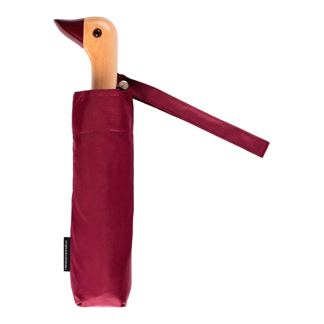 Compact umbrella in cherry with birchwood handle in the shape of duck head