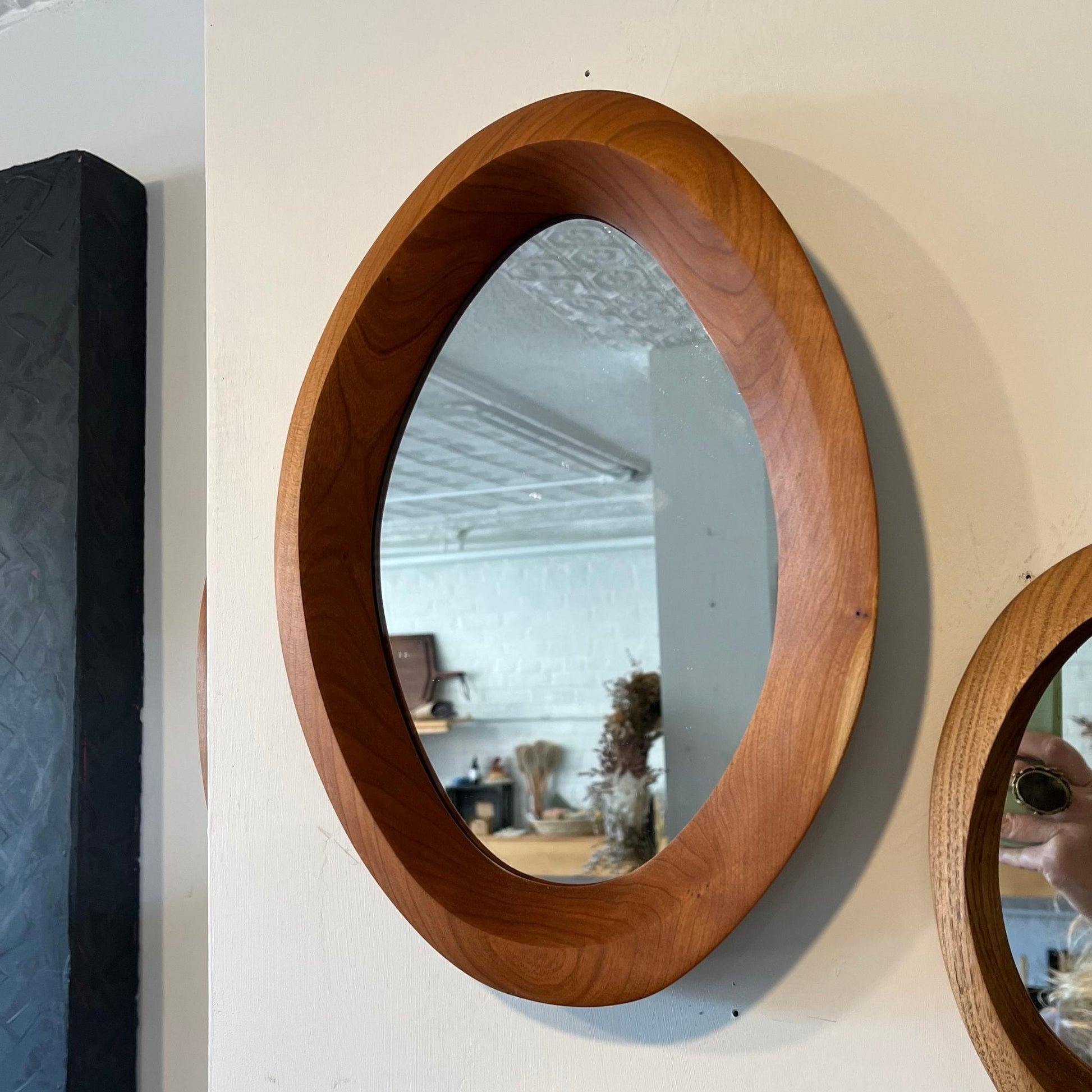 Large size hand-carved cherry wood wall mirror each with one-of-a-kind organic curves and shape